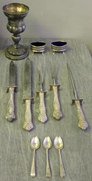 Silver Lot.: Includes a 19th century engraved chalice, a pair of hallmarked Georgian salts with cobalt liners, 6 Georgian teaspoons, and 5 sterling handled carving items by Gorham. From a Scarsdale, NY location.