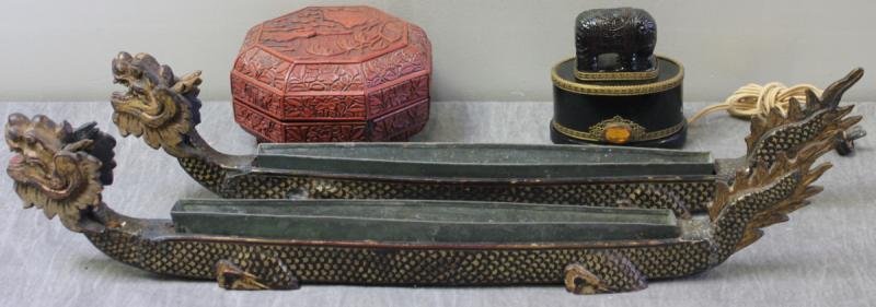 Antique Chinese Lot.: Includes a small hardwood stand, two lacquer dragoon boat planters with tin liners, a cinnabar covered box, and a probably amber elephant on glass lamp. From an Englewood, NJ estate. Condition: Lacque