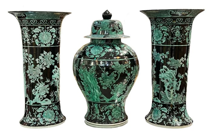 Mid-20th Century 3 Pc. Chinese Inspired Garniture: Set. n impressive pair of vintage Chinese export tall roll vases in jet black and light green, showcasing a monumental presence. These decorative porcelain pieces are entirely handcrafted and