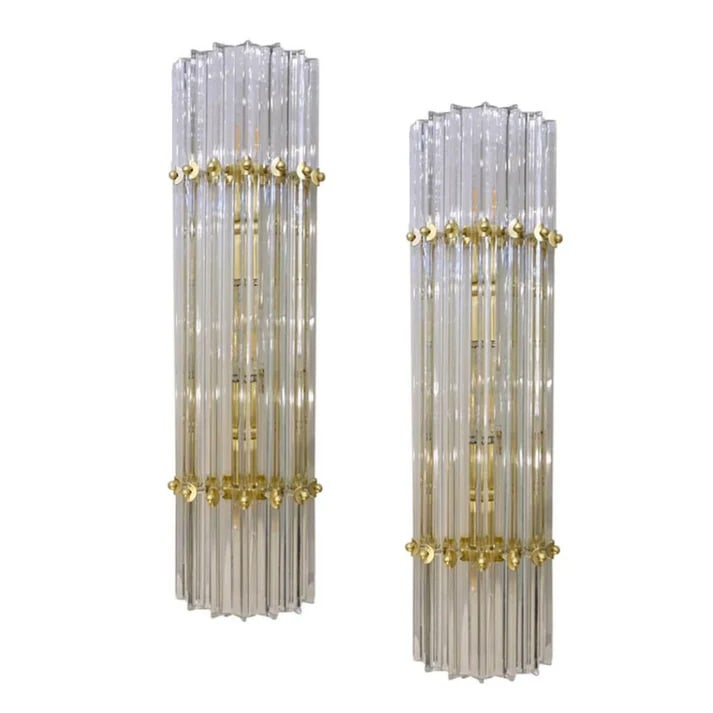 Italian Contemporary Pair of Brass and Murano: Glass Sconces. Very sleek custom Venetian pair of crystal wall lights with organic modern design, consisting of seven straight crystal clear Murano glass rods of triangular section with attractive