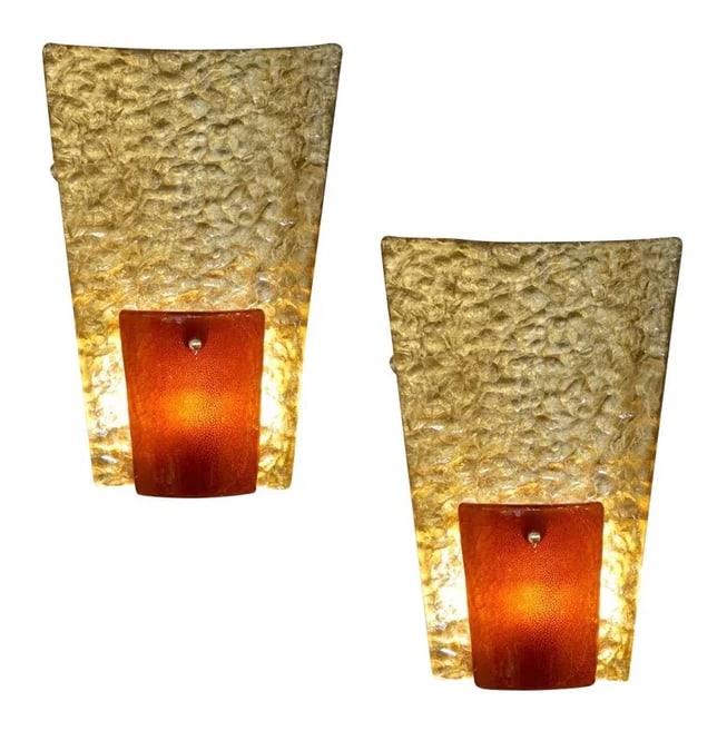 Contemporary Italian Pair of Gold and Amber Murano: Sconces. Modernist geometric pair of gold and amber/orange Murano glass wall lights, entirely handcrafted in Italy. A very interesting part is the thin backplate (1.5" wide), handmade in brass