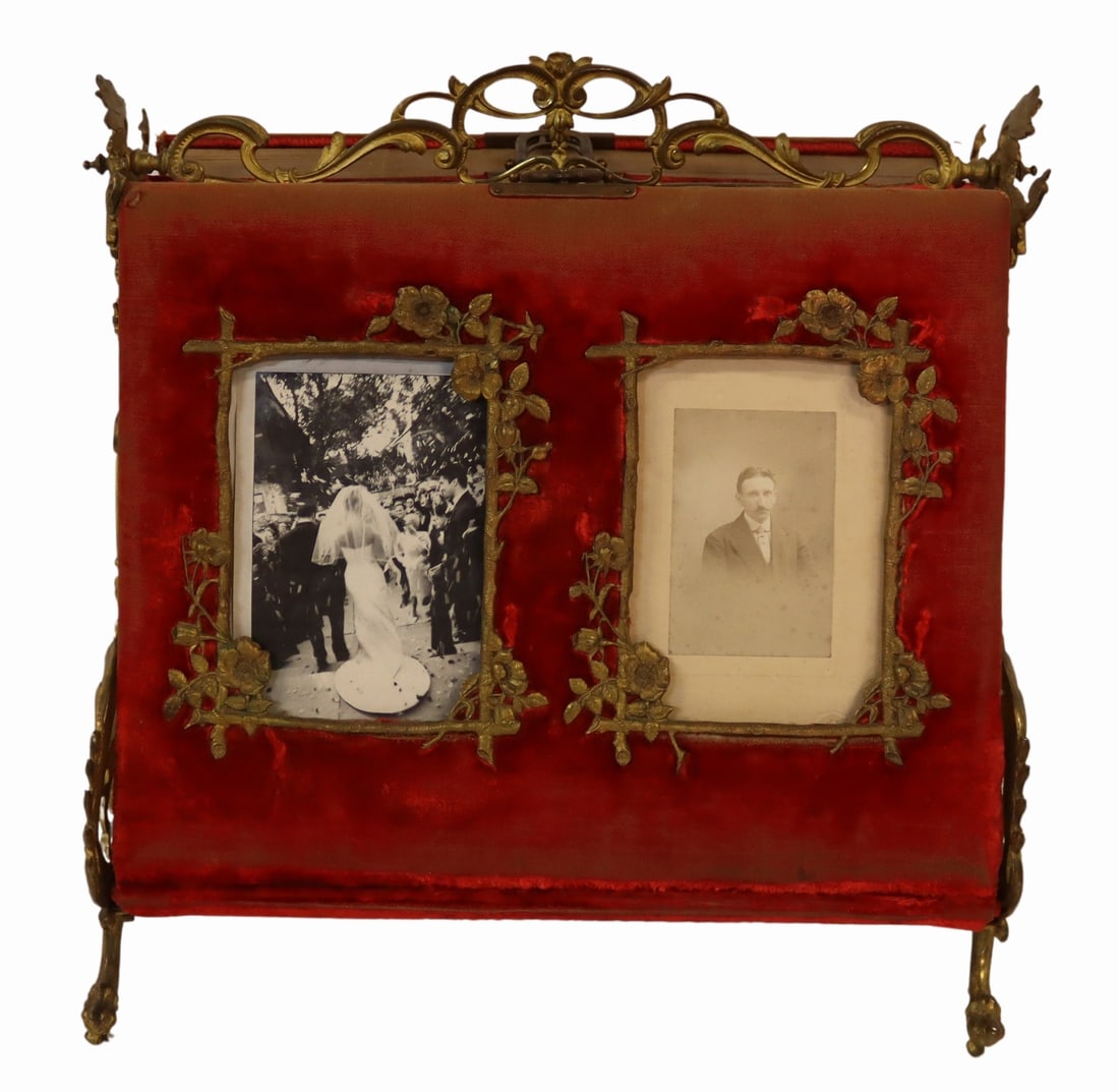 Victorian Red Velvet Double Sided Photo Album on: Stand. With ornate figural and floral details. From the curated 40+ year collection of Cosulich Interiors and Antiques. Dimensions: 14.25" w x 11.25" d x 14.375" h.
