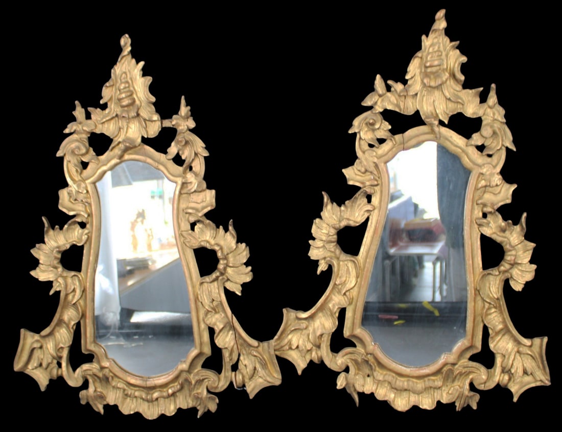 A Pair of Carved and Gilded Mirrors: A pair of carved and gilded mirrors. From a Brooklyn, NY estate. - Dimensions: 28.5" x 20"