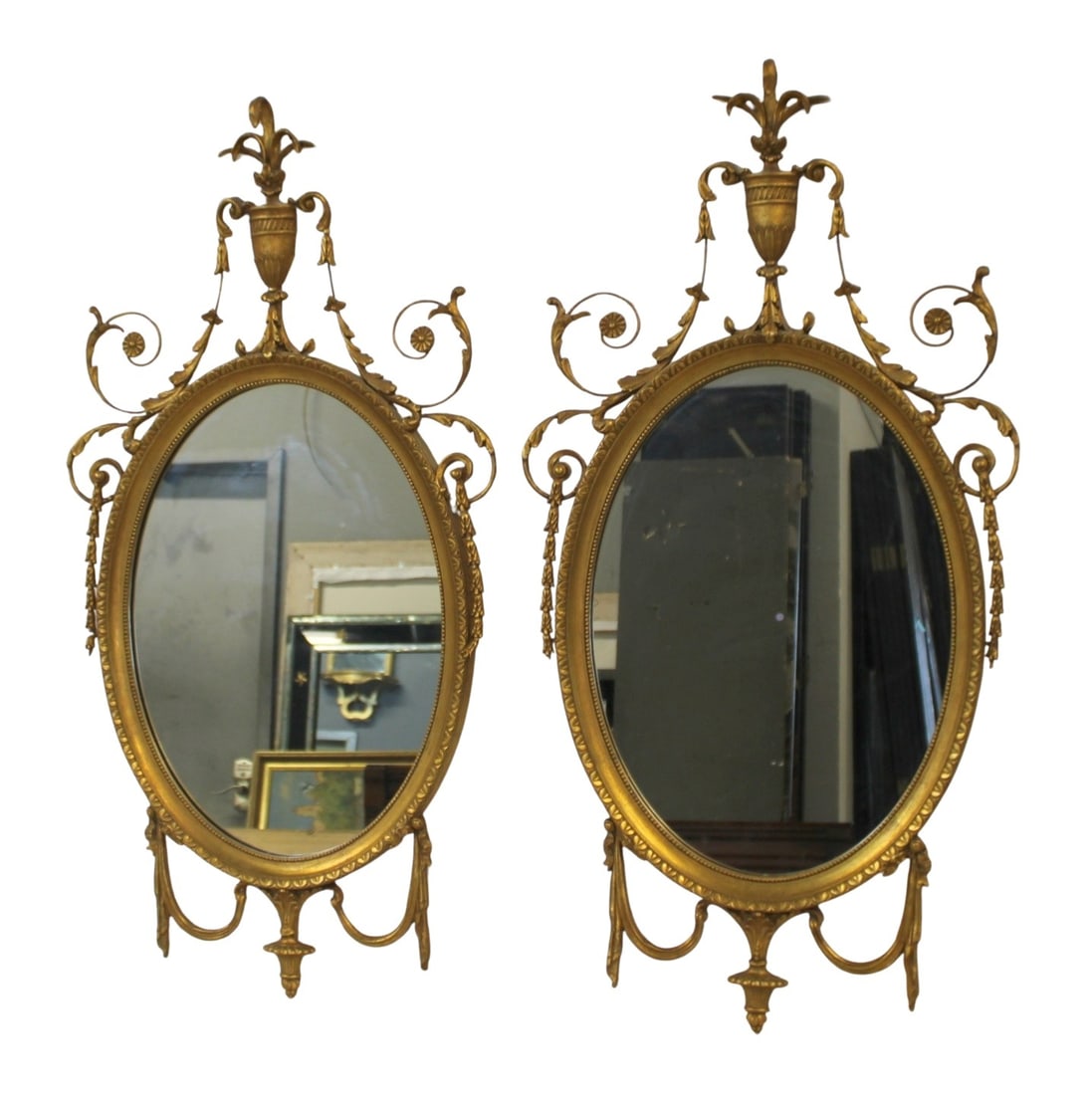 Vintage Pr Of Carved Giltwood Adams Style Mirrors: Nice quality and patina with urn and flower crown. From a Brooklyn, NY estate . - Dimensions: 34" x 21"