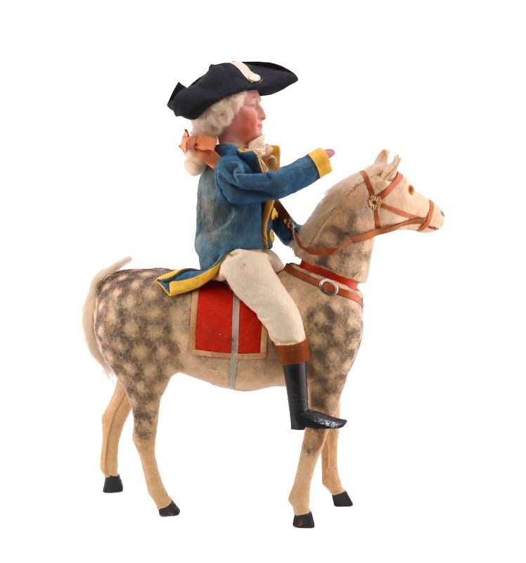 A Fine & Unusual George Washington Candy Container: A candy container in the form of George Washington riding a horse. The horse head is removable for candy. No better way to celebrate February 22nd than with this presidential candy container. - Dimens