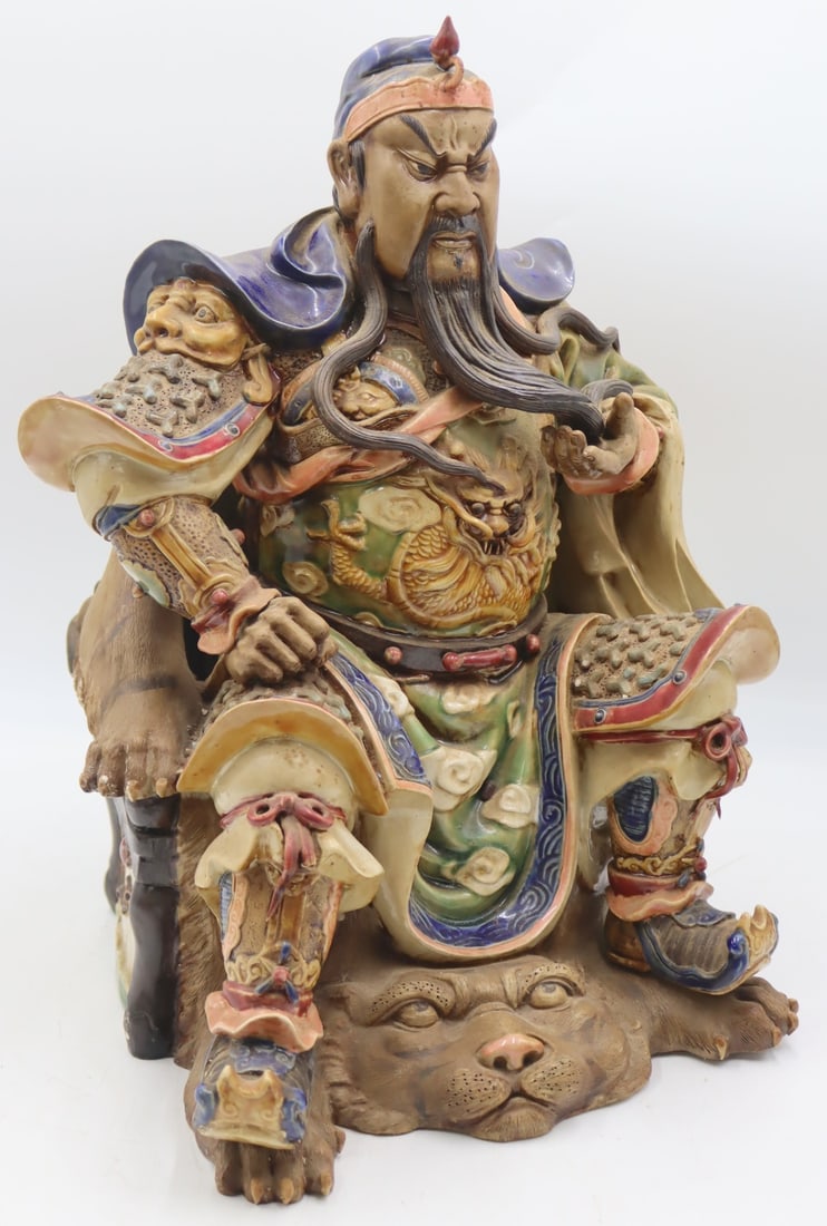 Signed Chinese Shiwan Style Guan Gong Seated: Warrior. From a Manhattan, NY estate. Dimensions: figure measures approx. 12.5" w x 16.5" h.