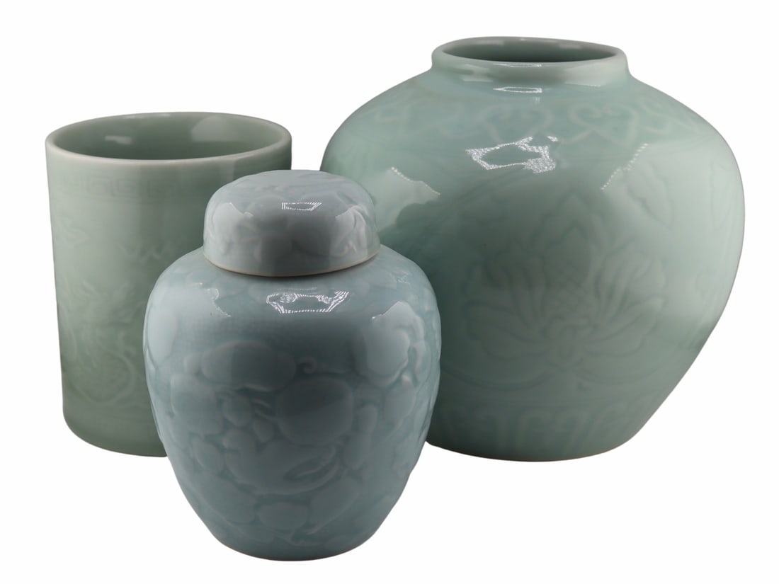 (3) Chinese Incised Celadon Ceramics.: Includes a Chinese incised celadon lidded pot or jar - accompanied by a Feb. 18 1981 Tung Cheng Peking Trading Co. stating, "Antique Celadon Pot"; a Japanese incised lidded jar - paper label