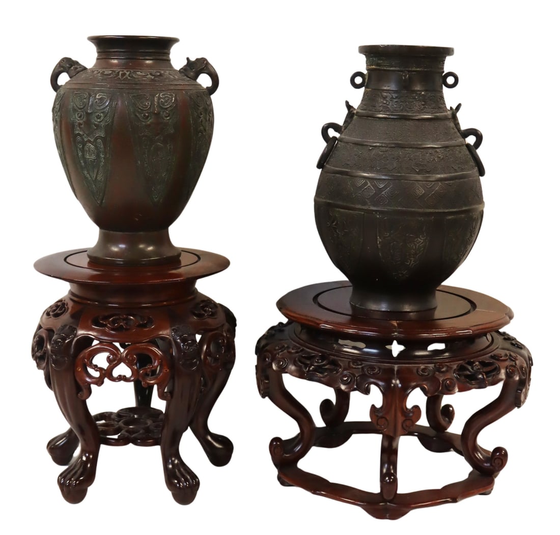 (2) Chinese Archaic Style Bronze Urns on Stands.: Includes a Chinese archaic style bronze urn with zoomorphic beast form handles and taotie panels; and a signed Chinese? archaic style bronze urn with ring form handles - signature to the underside. Ac