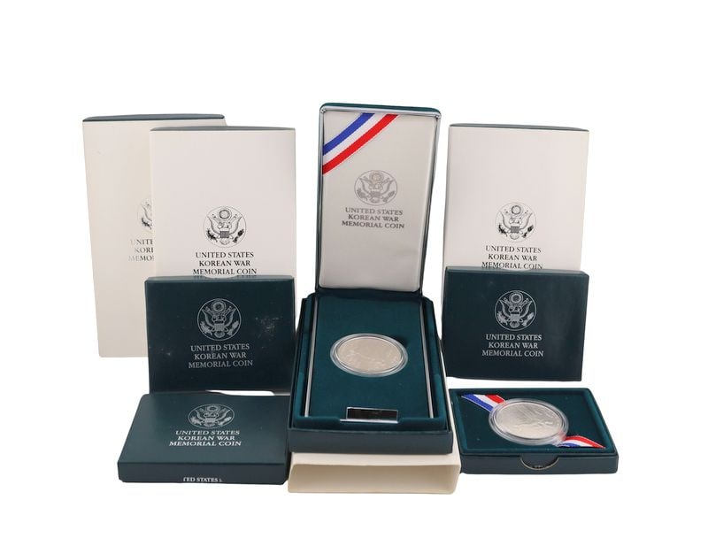 NUMISMATICS. (8) 1991 $1 Korean War Commem Silver: Dollars BU & Proof. Including (4) 1991 (Philadelphia struck ) $1 Proof Korean War Commemorative silver dollars, struck in .900 silver. The total mintage for this date and mint: 618,488. (4) 1991 D