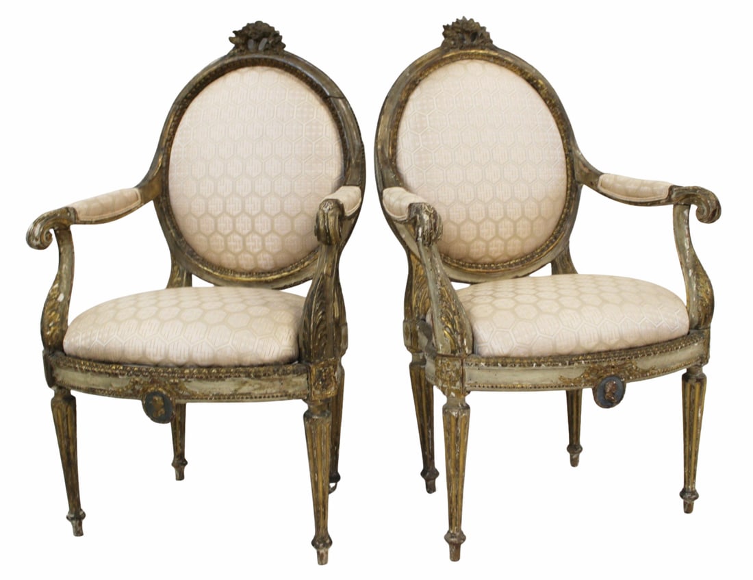 Finely Carved Pair of Louis XVI Arm Chairs.: Very finely carved with floral crown and ribbon and head crest, paint and gilt decorated. From a 740 Park Ave NYC estate. - Dimensions: 40" x 24" x 18"