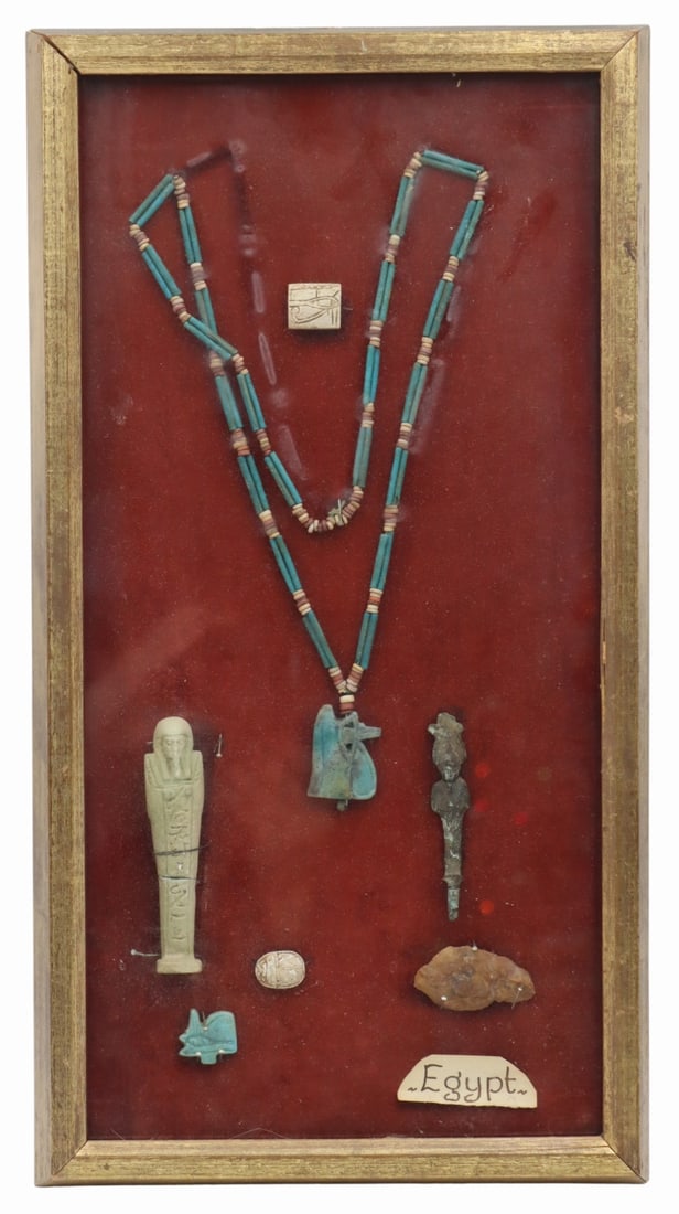 Framed Collection of Egyptian Artifacts.: Includes faience and carved examples. Objects are mounted within a frame and a small scrap of paper inscribed, "Egypt" is displaying in the lower right corner. From a Larchmont, NY estate. D