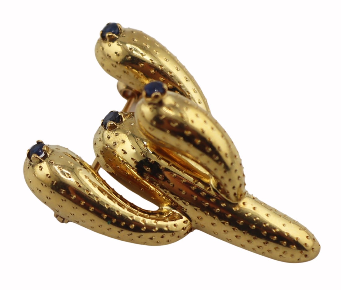 JEWELRY. Tiffany & Co. 18kt Gold and Sapphire: Cactus Brooch. Italian Tiffany & Co. 18kt yellow gold cactus brooch accented by (4) prong-set round faceted sapphires. Signed, "Tiffany & Co © 18kt Italy". Total approx. weight