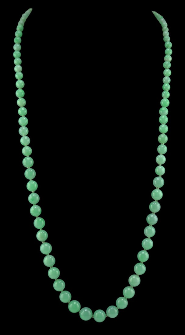 JEWELRY. Graduated Jade Beaded Necklace with 14kt: Gold and Diamond Clasp. Single strand necklace of individually knotted round jade beads with a bi-color 14kt gold clasp accented by diamonds. The largest bead measures approx. 10.0mm; the smallest bea