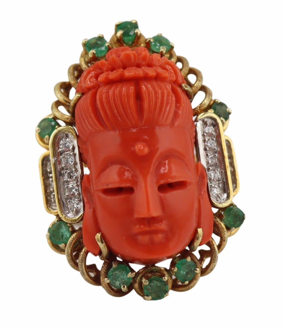 JEWELRY. 14kt Gold, Coral, Emerald and Diamond: Ring. Vintage 14kt yellow gold ring displaying a central carved salmon coral head of Buddha with accented by (10) round faceted emeralds and (16) round faceted diamonds. Reminiscent of David Webb.