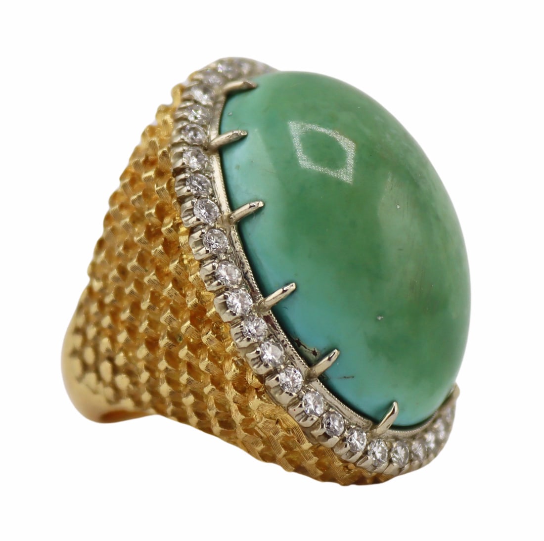 JEWELRY. 17.5kt Gold, Turquoise and Diamond Ring.: 17.5kt yellow gold cocktail ring displaying a central prong-set oval turquoise cabochon with a surround of round full cut diamonds. Apparently unmarked. Total approx. weight of the ring is 16.7 dwt