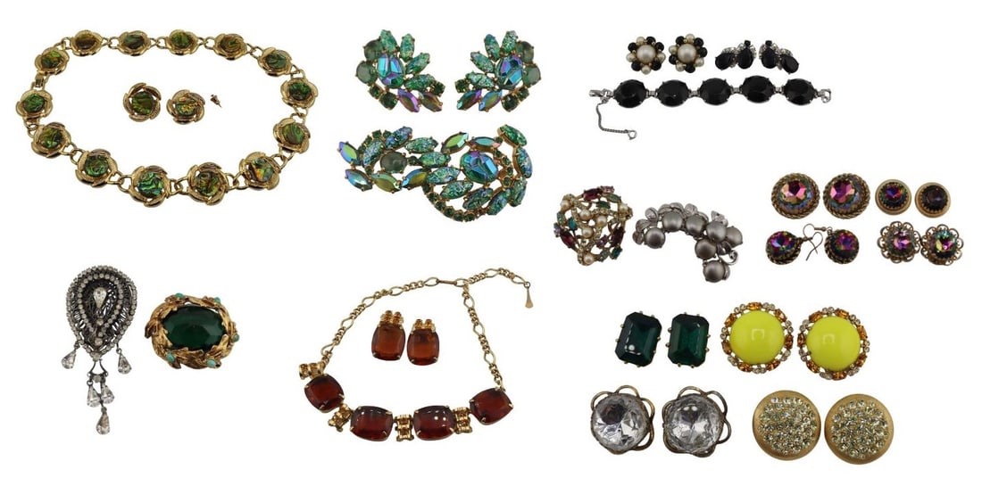 JEWELRY. Costume Jewelry Inc. Schiaparelli.: Includes a 3 pc. Schiaparelli gold-tone suite comprised of a brooch and a pair of matching ear clips - all displaying mottled green gems, cabochons, and faceted rhinestones, brooch is missing one