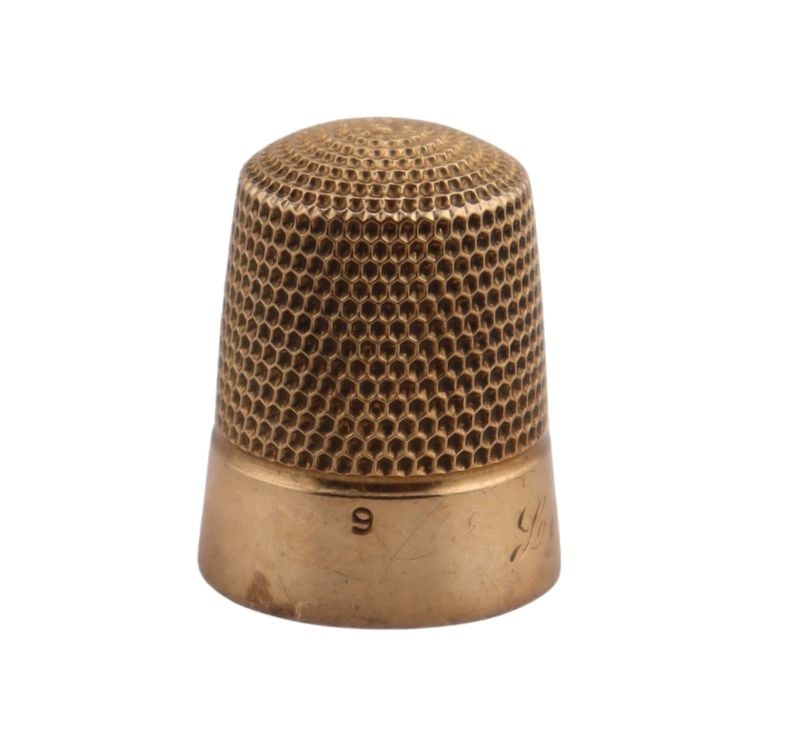 JEWELRY. 14kt Gold Thimble.: An engraved 14kt yellow gold thimble. Stamped, "14K". Total approx. weight is 2.9 dwt (gross). From a Harrison, NY estate. Dimensions: thimble measures approx. 15.85 mm in diameter.
