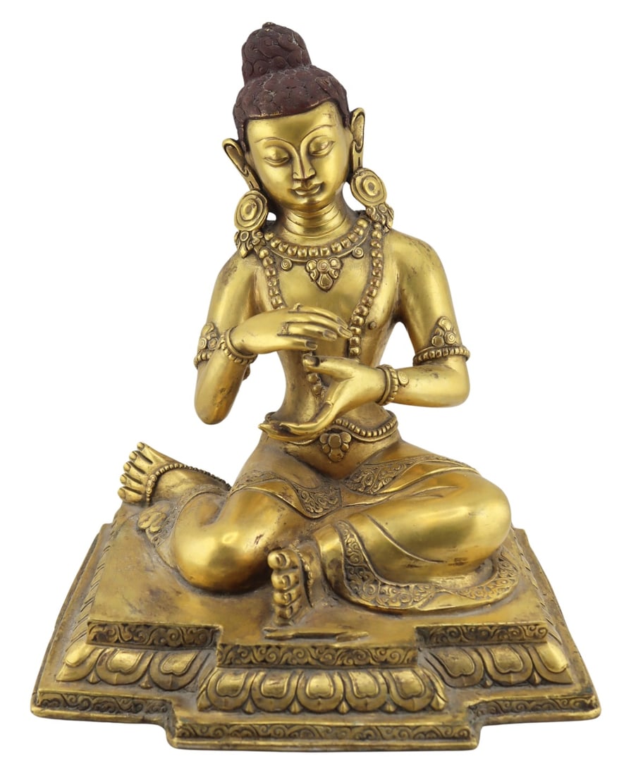 Southeast Asian Gilt Metal Seated Buddha.: Ornately adorned with earrings, necklaces, rings, bracelets, and arm cuffs. From a Gaylordsville, CT estate. Dimensions: 7.675" w x 6" d x 9" h.