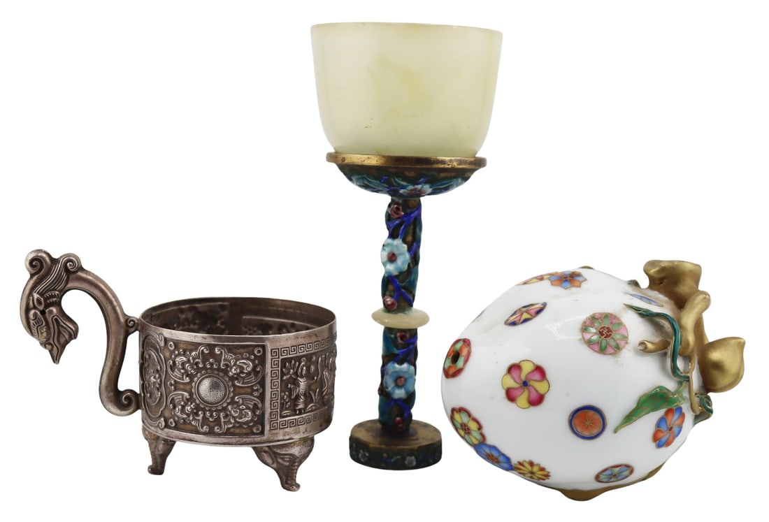 Collection of Chinese Decorative Objects.: Chinese silver cup displaying bat and figural depictions, a dragon form handle, and elephant form feet - with a four character mark to the underside; a Chinese Famille Rose and gilt decorated peach -