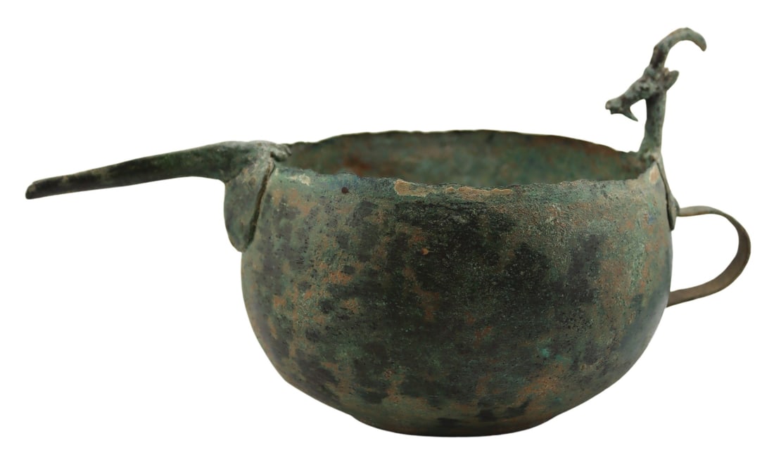Western Iranian Archaic Bronze Bowl with Figural: Handle. With horned beast handle and elongated spout. Probably 800-1200 BC. Total approx. weight of the bowl is 369.2 grams (gross). From a Woodside, NY estate. Dimensions: bowl measures approx.