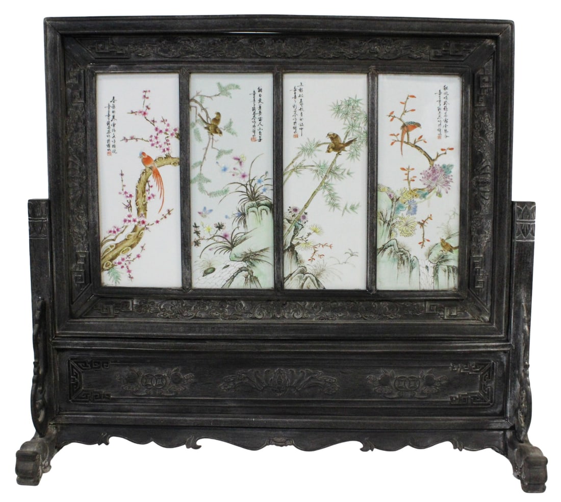 Chinese 4-Panel Enamel Decorated Table Screen.: Signed Chinese four panel porcelain plaque displaying various birds and flora set within a carved wood frame that fits within a footed carved wood stand. From a Ridgewood, NY estate. Dimensions: