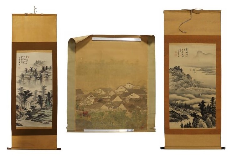 (3) Signed Chinese Scrolls.: Includes a signed Chinese scroll painting of village from afar - approx. 42" w x 61" h; a Chinese scroll displaying pine trees, signed upper left - image only measures approx. 15.5" w