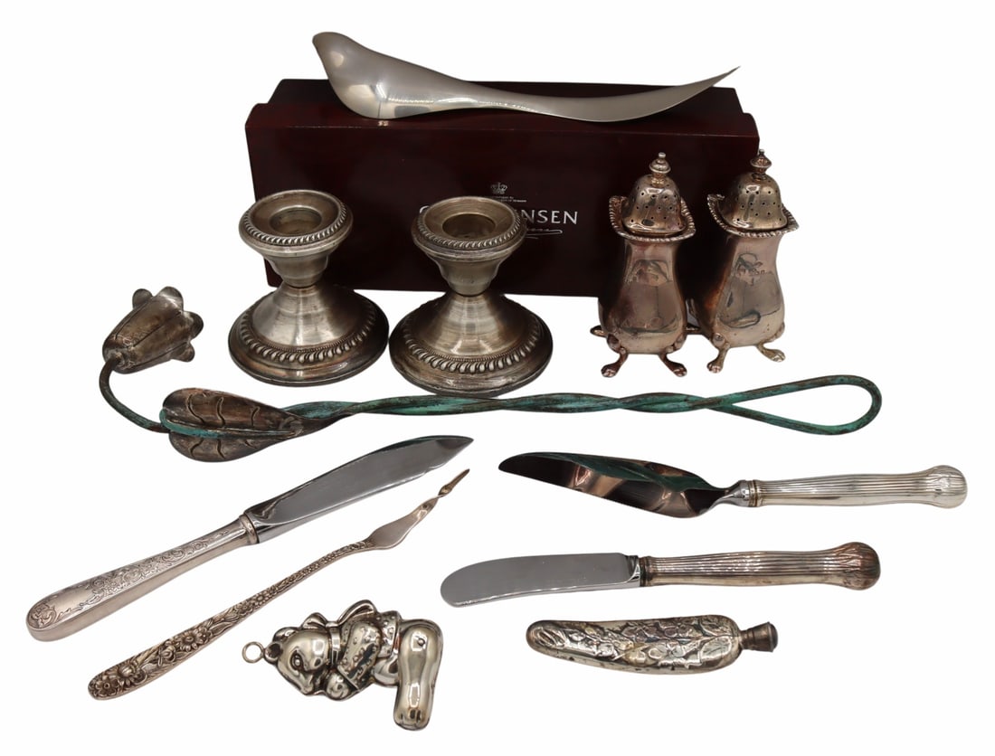 SILVER. Collection of Silver Hollowware & Objects.: Includes an Emilia Castillo sterling foliate form candlesnuff with twisted snuff; a pair of weighted sterling candles; a monogrammed pair of English silver footed shakers - Birmingham, Adie Bros. Ltd.