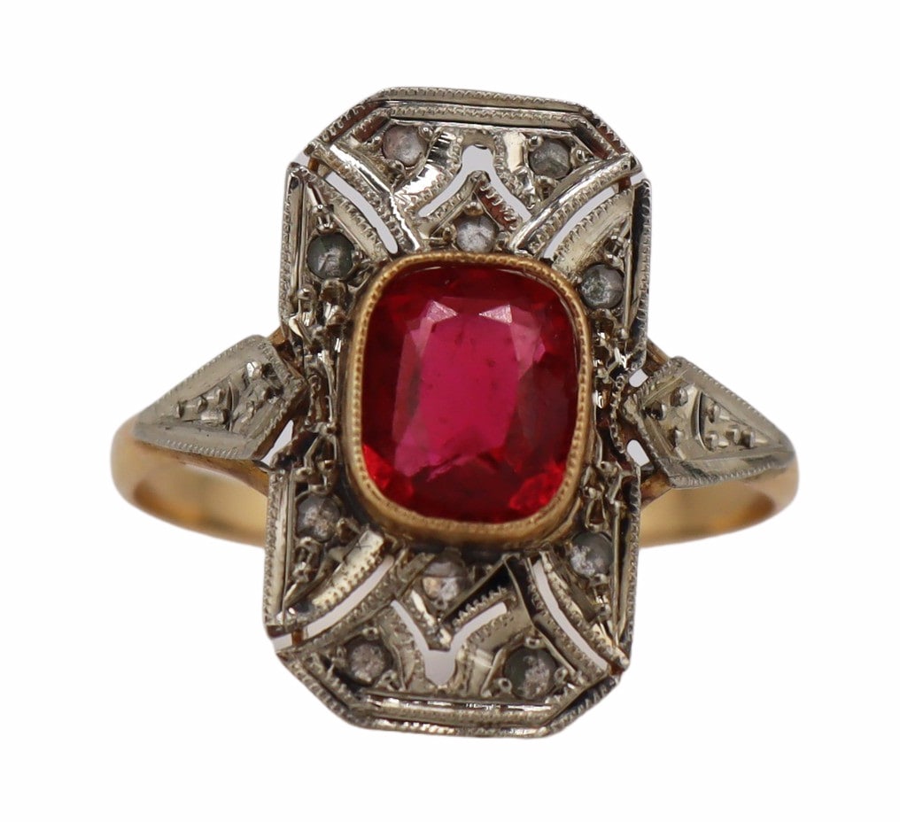 JEWELRY. French 18kt Gold, Silver, Gem and Diamond: Ring. Signed French silver-topped 18kt yellow gold ring displaying a rectangular cut corner ring face with central bezel set faceted pink gem surrounded by table cut diamonds. With French domestic hal