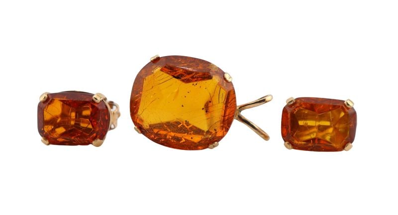 JEWELRY. Gold and Amber Jewelry Grouping.: Including an unmarked 13kt yellow gold pendant with a prong-set polished piece of amber; and a pair of 14kt yellow gold earrings each with a prong-set polished piece of amber - stamped, "14K"