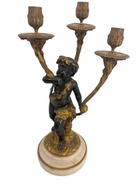 Antique Gilt & Patinated Bronze Candle Holder.: Caldwell quality, Cherub holding candelabra on a bronze and marble base. From a Yonkers, NY estate. - Dimensions: 16.25" h x 9.75" w.