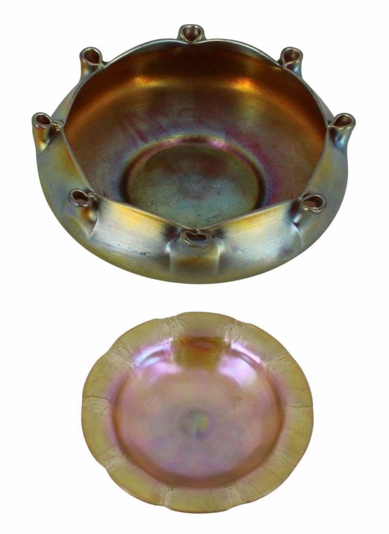 TIFFANY & STEUBEN Lot of Favrile Glass.: Includes a Tiffany Favrile tazza (2" x 6"), numbered and with paper label; together with a large Steuben Aurene bowl (3" x 10"), #2775. From a New Rochelle, NY estate.