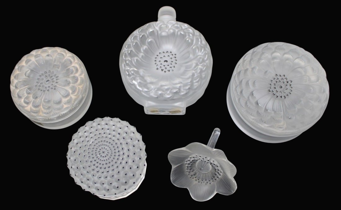 Lalique France Collection of 5 Items.: Includes a scent bottle (7" h x 5.5" w), a flower (4.5" long), and 3 lidded boxes (ranging 3.75" h x 4.25" to 3.25" h x 5.5" d). From a New Rochelle, NY estate.
