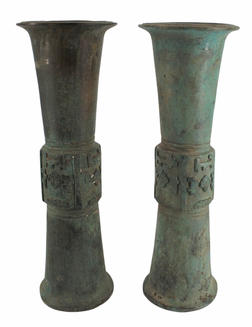 Pair of Chinese Archaic Style Gu Form Bronze Vases: From a Westchester, NY estate. Dimensions: vases measure approx. 17.25" h.