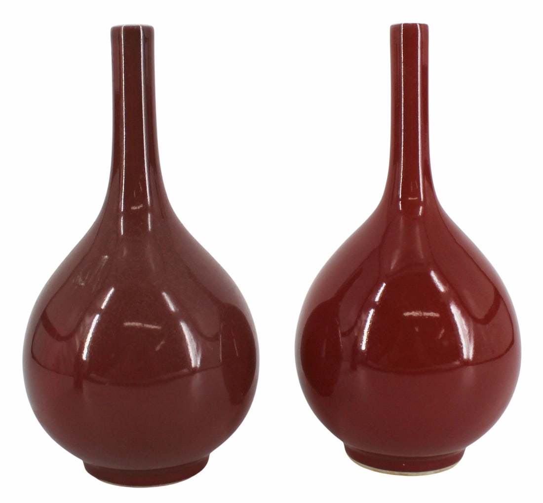 Near Pair of Chinese Ox Blood Bottleneck Vases.: Near pair of Chinese Ox Blood vases - one with a blue double ring mark to the underside. From a Westchester, NY estate. Dimensions: vases measure approx. 9.675" h and 9.75" h.