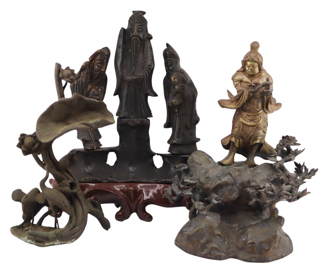 (3) Chinese or Japanese Bronzes.: Includes a Japanese bronze figural grouping of two herons and lotus flowers; a Chinese gilt bronze deity of guardian standing atop a rock surrounded by flora; and a Chinese bronze figural grouping of