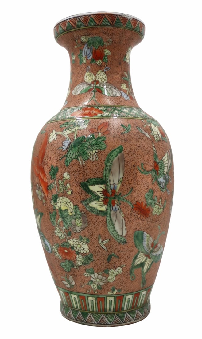 Chinese Famille Verte Butterflies and Flowers Vase: Chinese Famille Verte enamel decorated vase displaying butterfly and flowers set against a mottled iron red ground. Displaying a partial 6-character mark to the underside. From an E 79th St, Manhattan