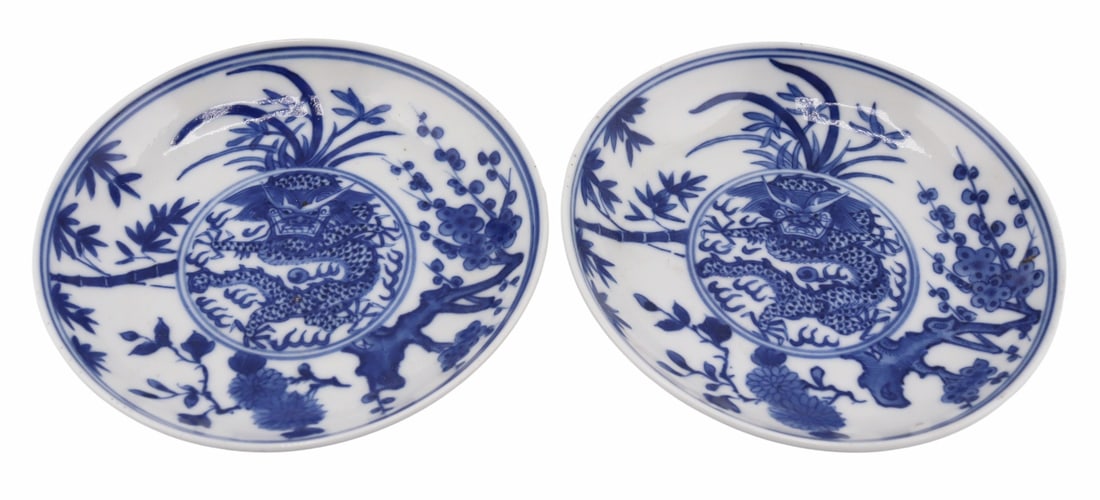 Pair of 19th C Chinese Blue and White Saucers.: Pair of 19th century Chinese blue and white 'dragon' saucers. With 6-character marks to the underside of each. From a Westchester, NY estate. Dimensions: saucers measure approx. 4" in diameter.