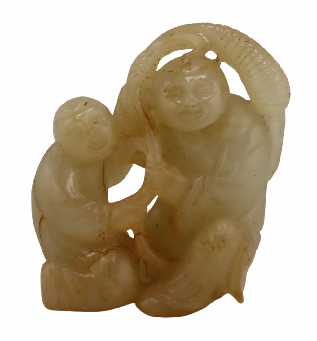 Chinese Greyish-White and Russet Set Carving.: Displaying two figures squatting beneath a flora. Total approx. weight of the carving is 173.9 grams (gross). From a Great Neck, NY estate. Dimensions: carving measures approx. 2.75" w x