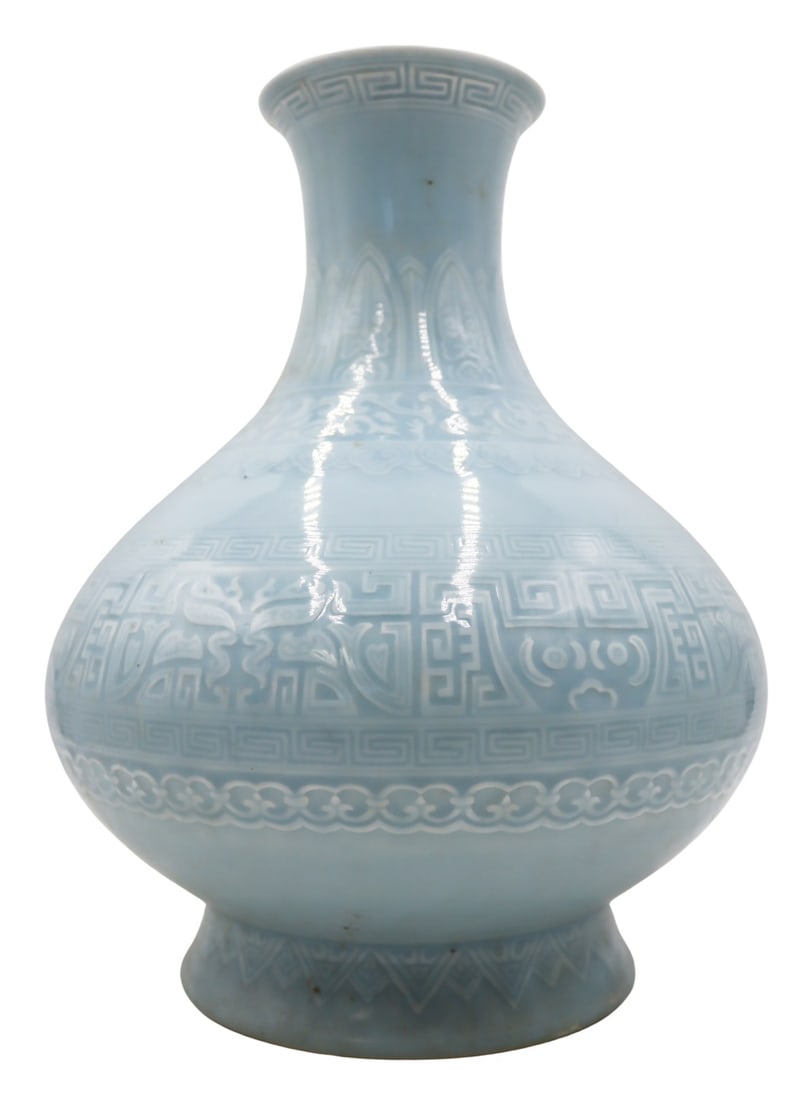 Chinese Archaic Style Incised Blue Vase.: Displaying an Archaic motif throughout with ruyi pendants, Greek key borders, and Archaic designs. With a Qianlong mark to the underside. From a Great Neck, NY estate. Dimensions: vase measures
