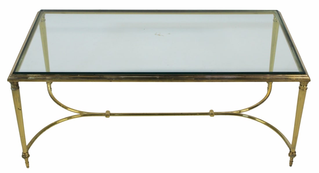 After Maison Jansen Brass & Glass Coffee Table.: Great quality, heavy with gilt metal (possibly bronze) base. From an Ardsley, NY estate. - Dimensions: 17" x 41.5" x 21.5"