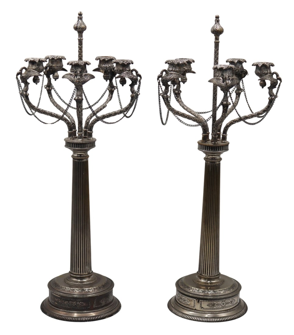 SILVERPLATE. Pair of Ornate Silverplate Candelabra: From an E 72nd St, Manhattan estate. Dimensions: candelabra measure approx. 24.75" high.