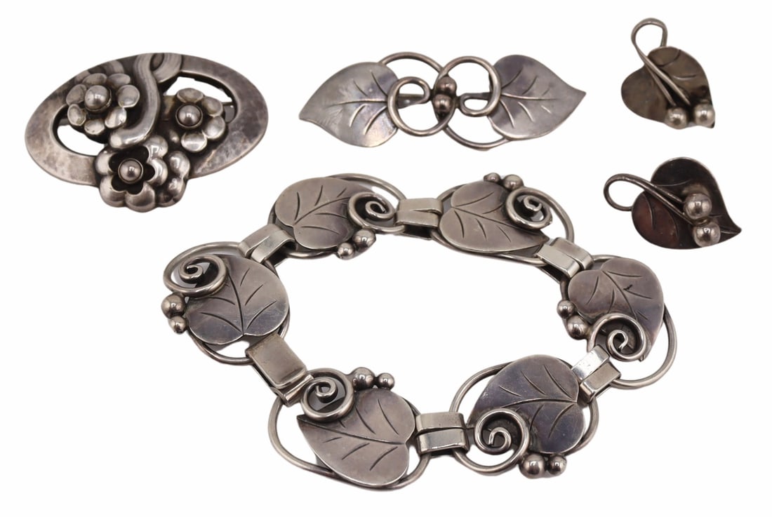 JEWELRY. La Paglia & Georg Jensen Sterling Jewels: Includes a Georg Jensen Danish handhammered sterling floral brooch, no. 29; and a 2 pc. La Paglia for International sterling leaf motif jewelry suite including a bracelet and brooch; and a similar