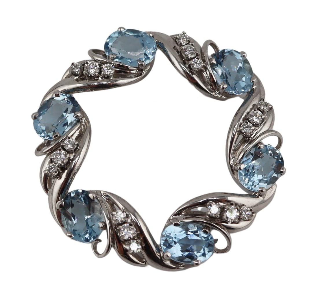 JEWELRY. 14kt Gold, Gem and Diamond Brooch.: 14kt white gold wreath form brooch displaying (6) oval faceted blue gems accented by trios of round full cut diamonds. (6) aquamarines measure approx. 5.5mm x 7.5mm; (18) diamonds measure approx.