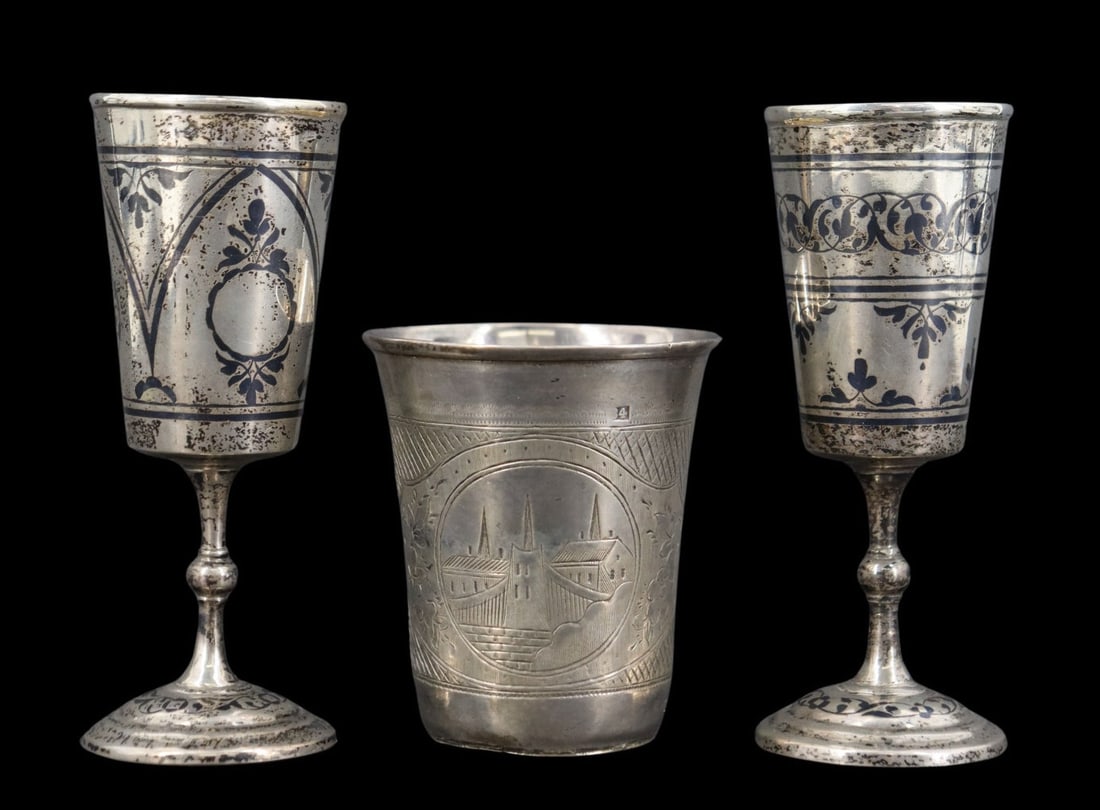 SILVER. (3) Assorted Russian Silver Cups.: Including a near pair of Soviet Russian (Sovetskoye Serebro) .875 silver niello cups with an interior gold wash - each stamped, "875" alongside a pictorial mark of a hammer and sickle; and a