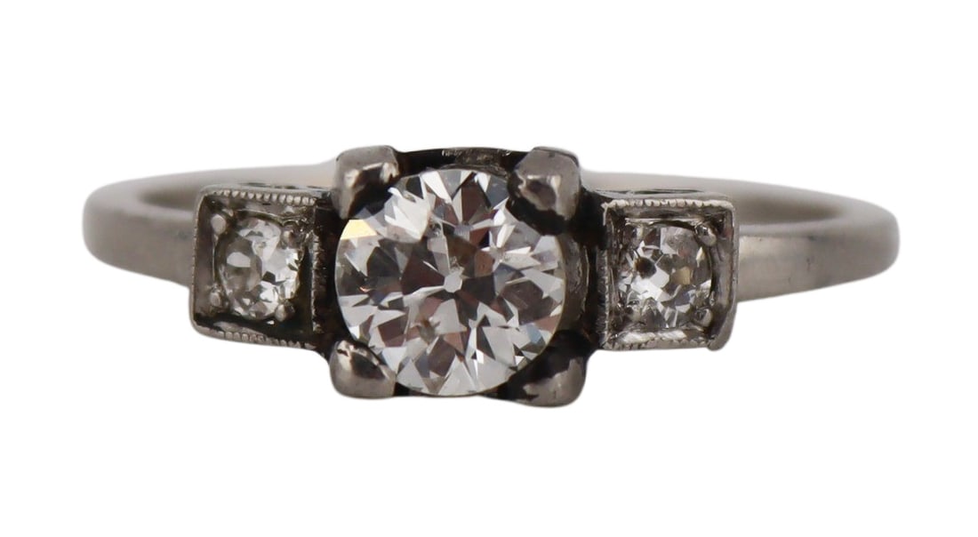 JEWELRY. Platinum and 0.50ct Old European Cut: Diamond Engagement Ring. Platinum engagement ring displaying a central Old European cut diamond measuring approx. 0.5cttw flanked by (2) Old European cut diamonds measuring approx. 2.5mm each.