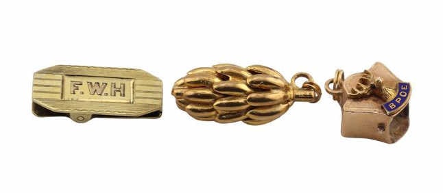 JEWELRY. (3) Assorted Gold Pendants.: Including an English 9kt yellow gold banana cluster pendant - stamped, "375"; a monogrammed 14kt yellow gold clip - stamped, "14K"; and a 10kt yellow gold pendant - stamped,