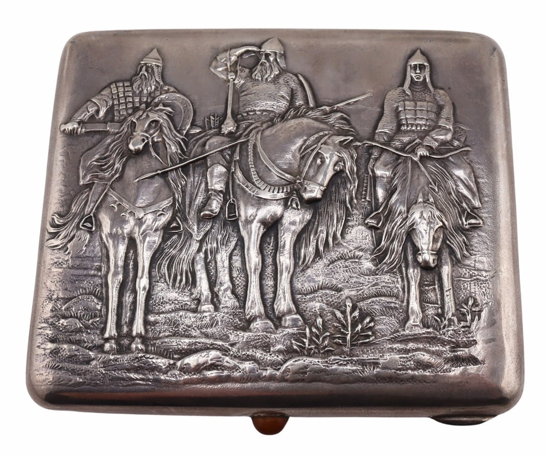 SILVER. Russian Silver "Three Heroes" Case.: Russian silver cigarette case displaying "three heroes" or "bogatyrs". With an oval gem cabochon closure. Stamped to the interior of the case. Total approx. weight of the case is 5