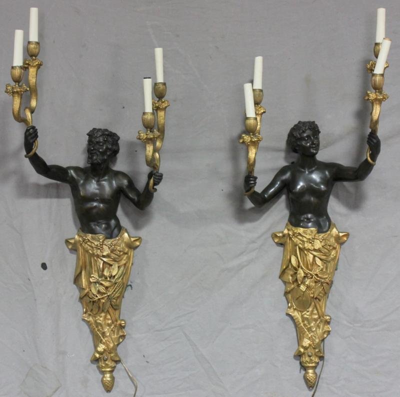 Pair of Male & Female Bronze and Patinated Figural: Sconces. Like everything from this estate these are large and of great quality. From an Old Westbury, NY estate. Dimensions: Bronze - 37" high x 14" wide. Condition: Good.