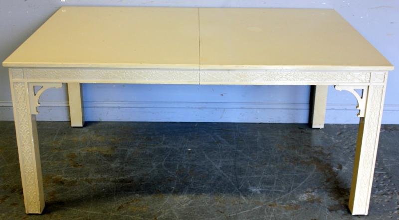 White Lacquered Dining Table.: With 2 leaves. From a Woodmere, NY estate. Dimensions: 65" wide x 45" deep x 30" high; Leaves - 18" wide.