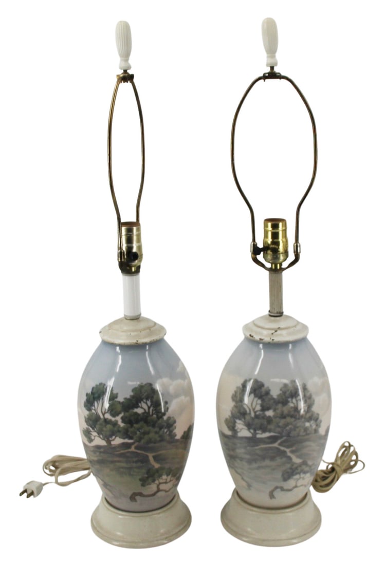 Pair of Royal Copenhagen (?) Porcelain Lamps.: A pair of Royal Copenhagen (?) vases mounted as lamps. The lamps depict a farmhouse between a lake and a forest glade. From a Mamaroneck, NY estate. Dimensions: Porcelain 10" and to finial 28&quo